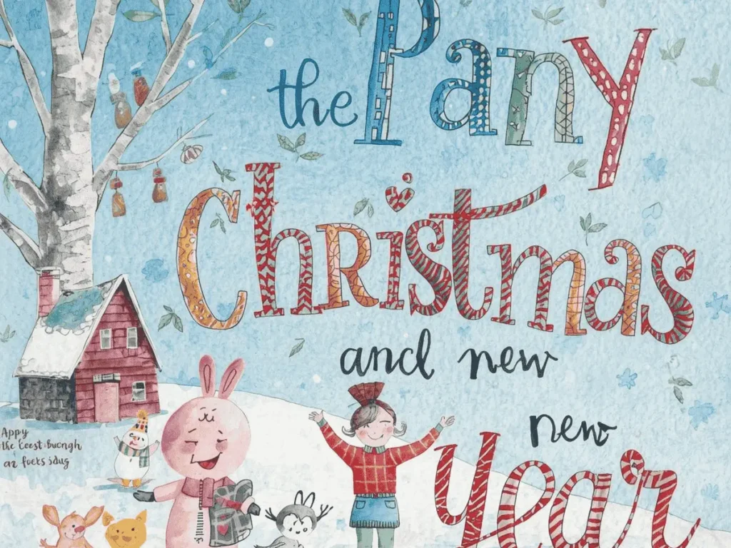 A top-down view of a notebook with simple doodles of snowmen and fireworks, next to a red mug and silver jingle bells on a wooden desk in warm evening light.