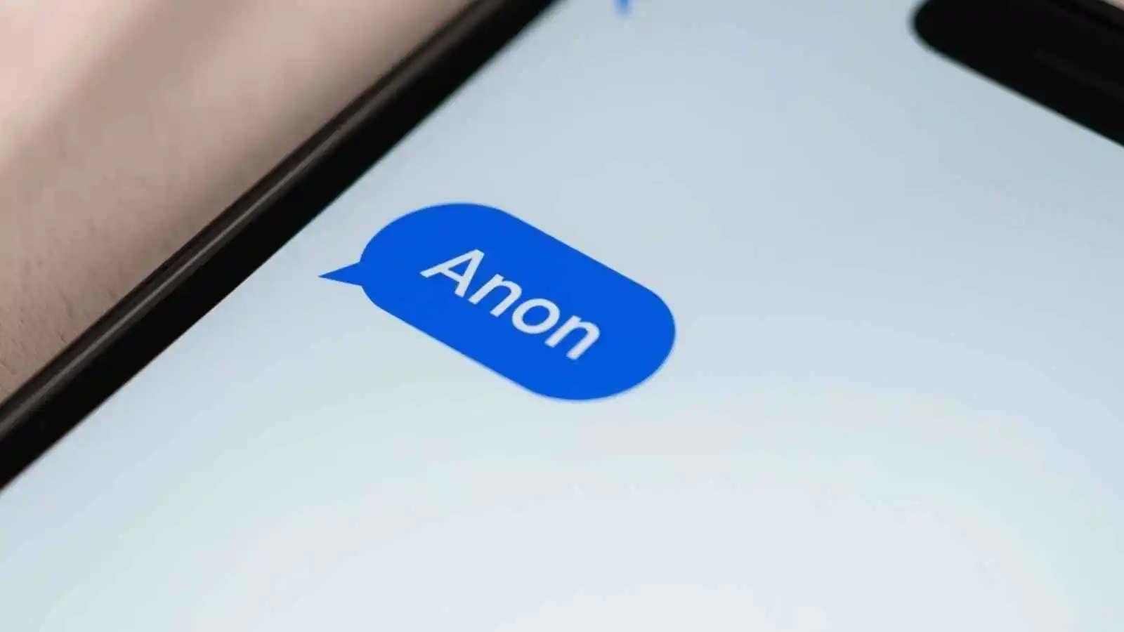 A smartphone displaying the word "anon" in a text message bubble.