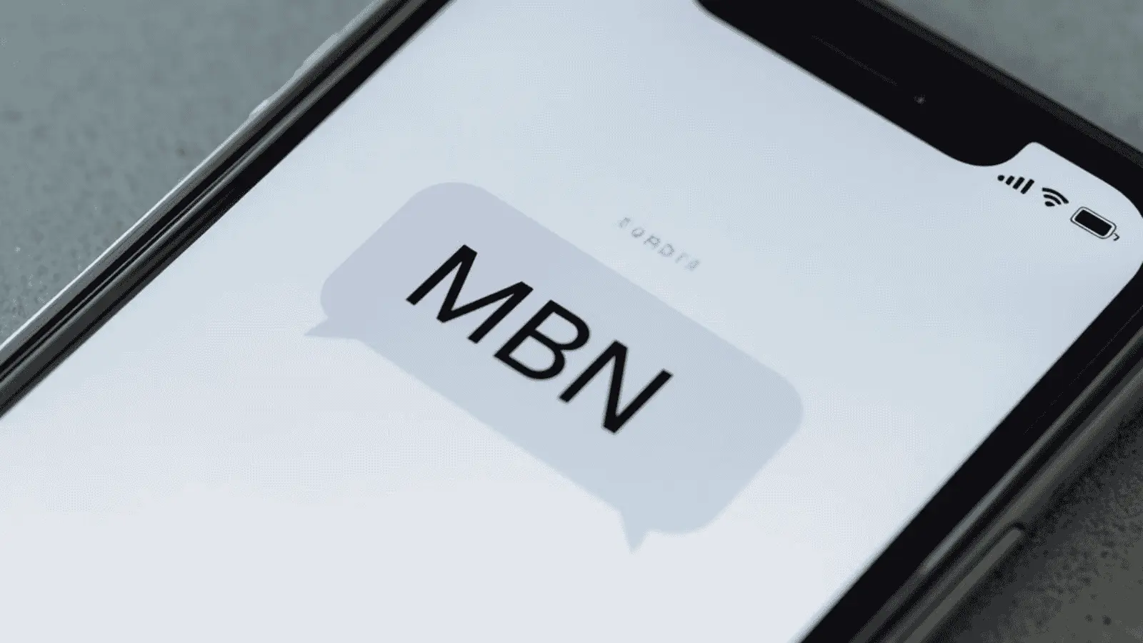 A smartphone displaying a text message with the abbreviation MBN.